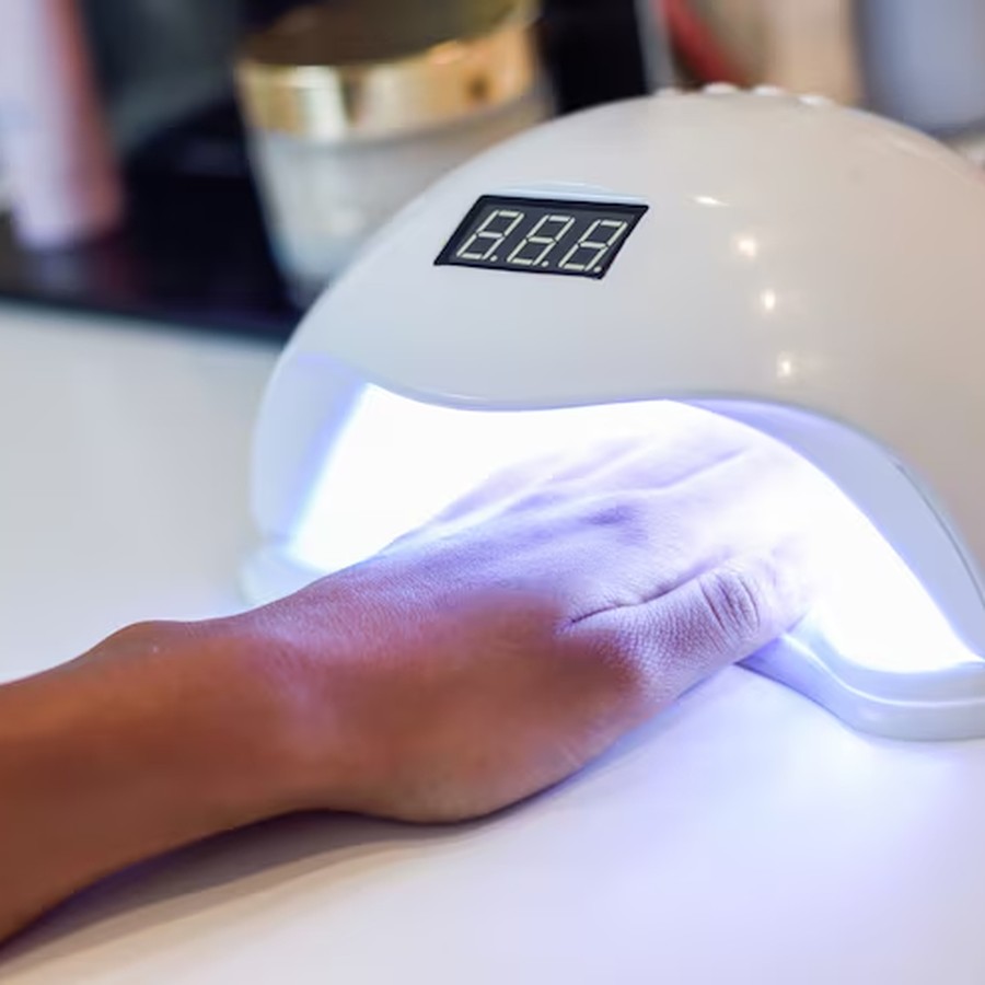 UV/LED nail lamp in use